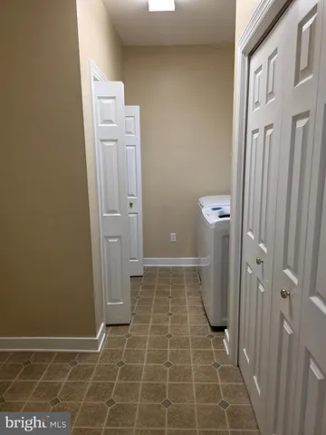 a bathroom with a glass door shower