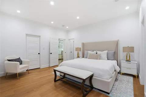 a bedroom with a bed and a chair