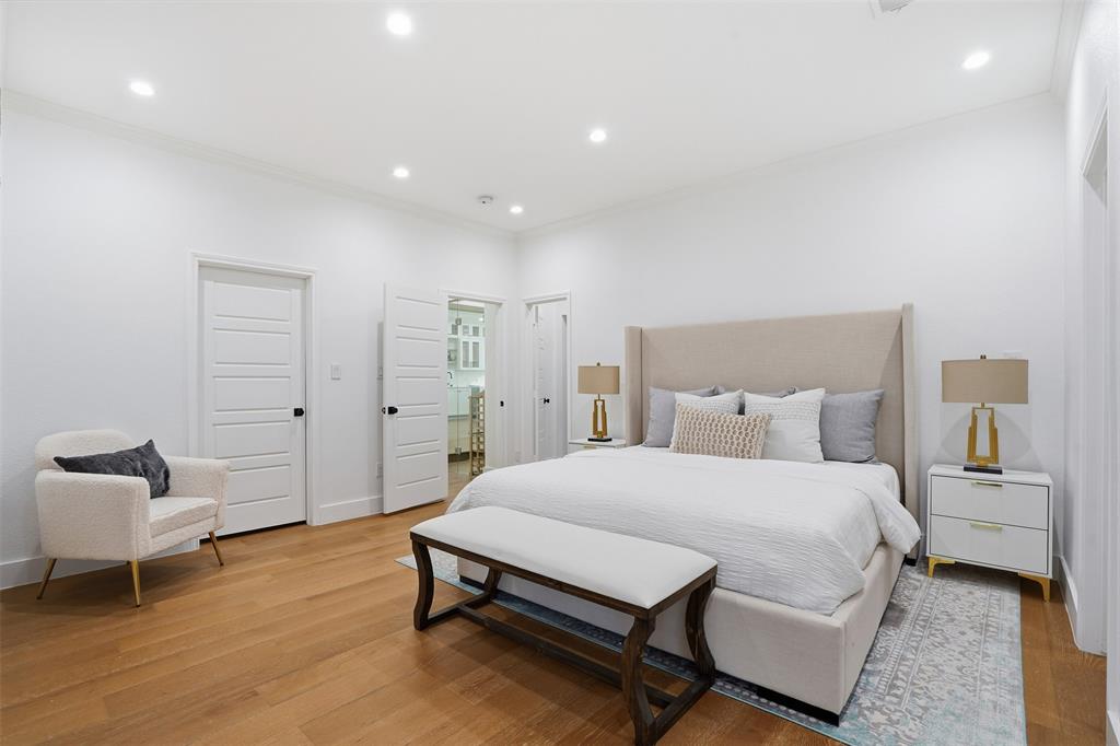 2 Parliament Place Dallas, TX 75225 - Photo 12 of 40 a bedroom with a bed and a chair