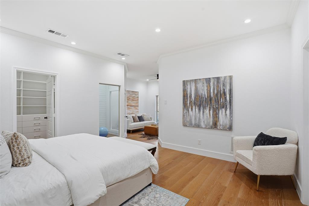 2 Parliament Place Dallas, TX 75225 - Photo 13 of 40 a bedroom with a bed and a chair