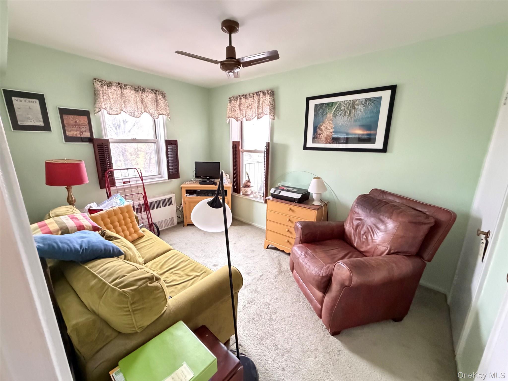 682 Tuckahoe Road, Unit 3D Yonkers, NY 10710 - Photo 13 of 18 a living room with furniture or couch and a window