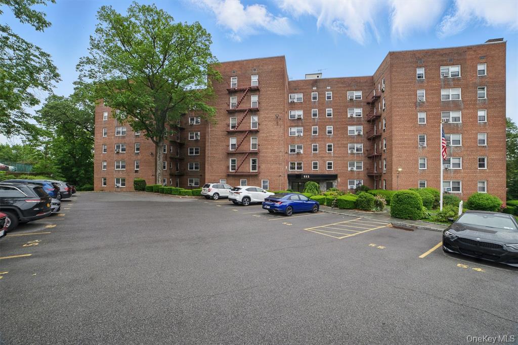 682 Tuckahoe Road, Unit 3D Yonkers, NY 10710 - Photo 15 of 18 a view of a street with a cars parked in front of it