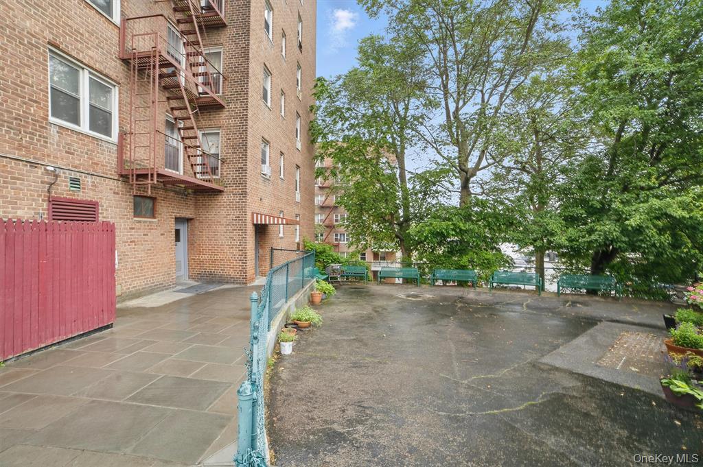 682 Tuckahoe Road, Unit 3D Yonkers, NY 10710 - Photo 16 of 18 a view of a street with cars parked in front of it