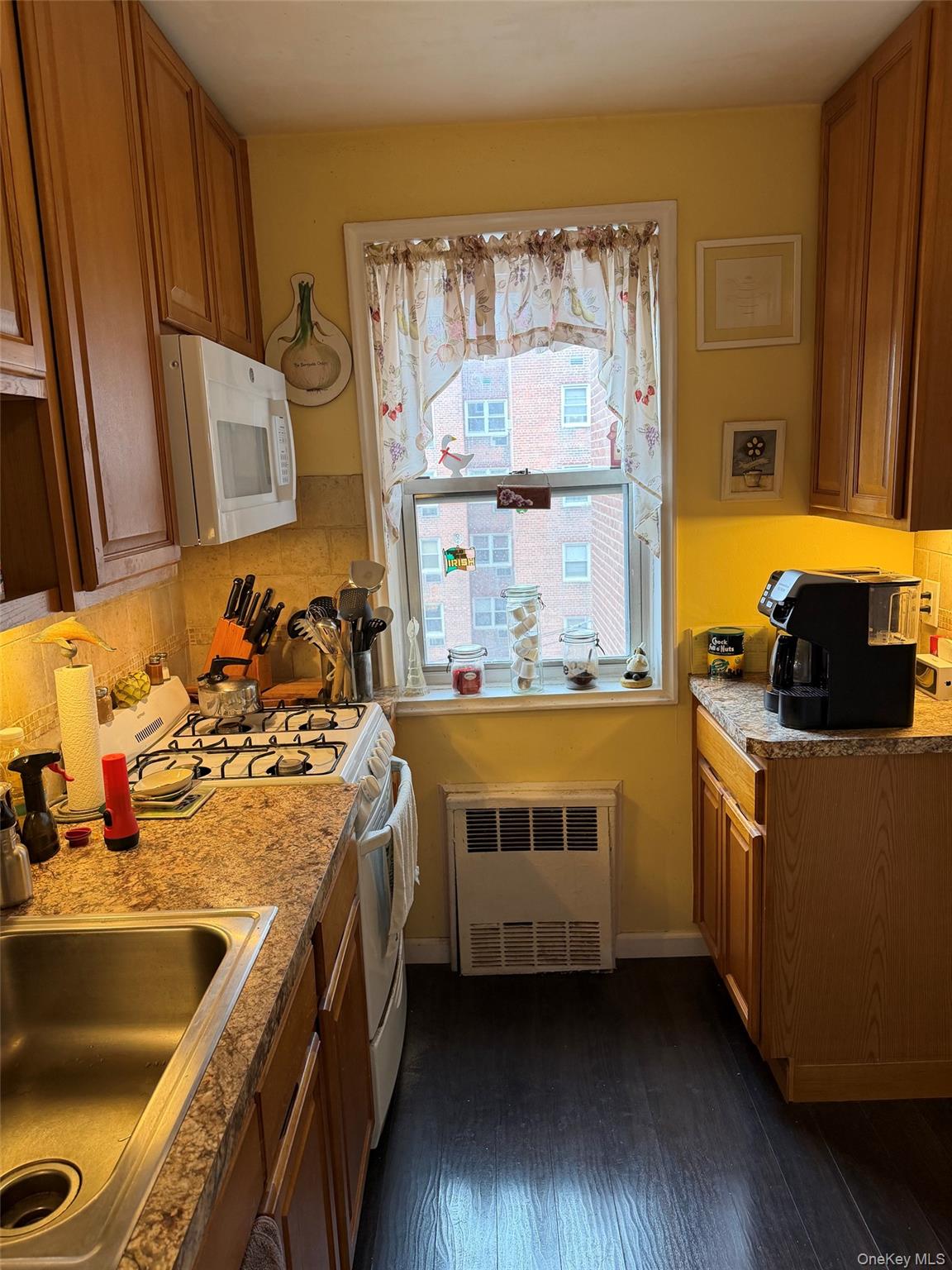 682 Tuckahoe Road, Unit 3D Yonkers, NY 10710 - Photo 7 of 18 a kitchen with a sink and a stove top oven