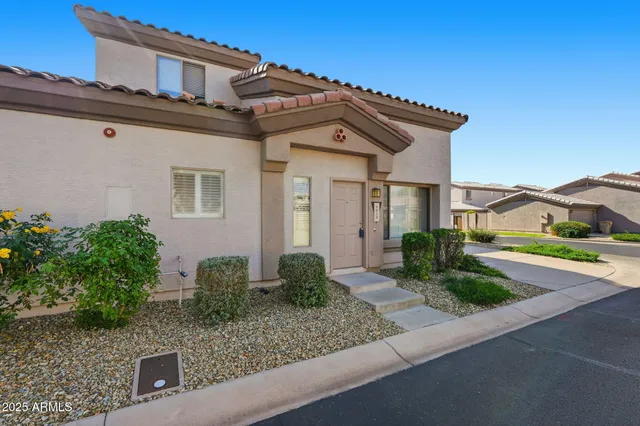 front view of a house with a small yard