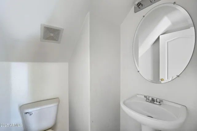 a bathroom with a double vanity sink and mirror
