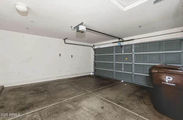 a bathroom with a shower and a glass door