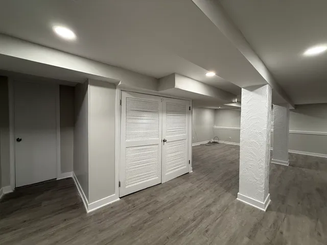 an empty room with wooden floor