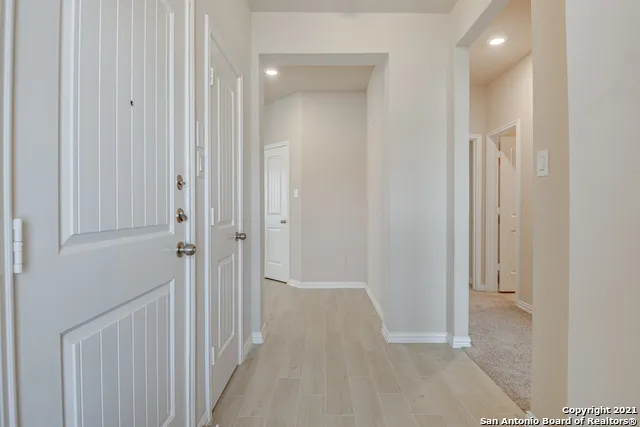 a view of a hallway with closet area