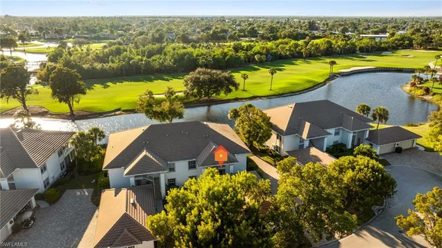 an aerial view of a house with a ocean view