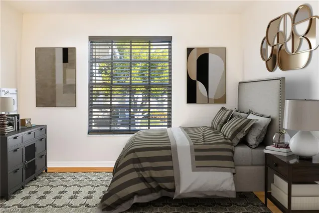 a bedroom with a bed and dresser