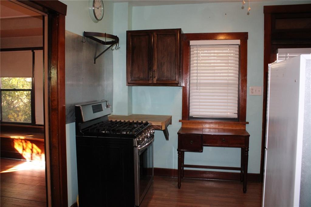 4020 Davis Avenue Homestead, PA 15120 - Photo 14 of 46 a kitchen with a refrigerator and a window