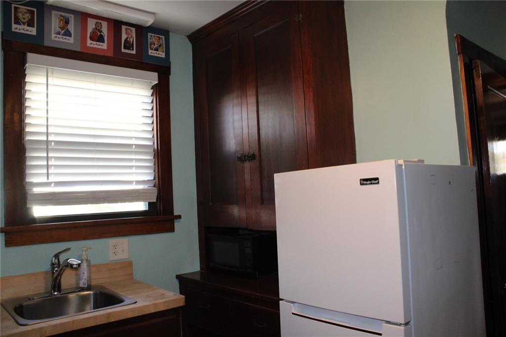 4020 Davis Avenue Homestead, PA 15120 - Photo 15 of 46 a room with refrigerator and window