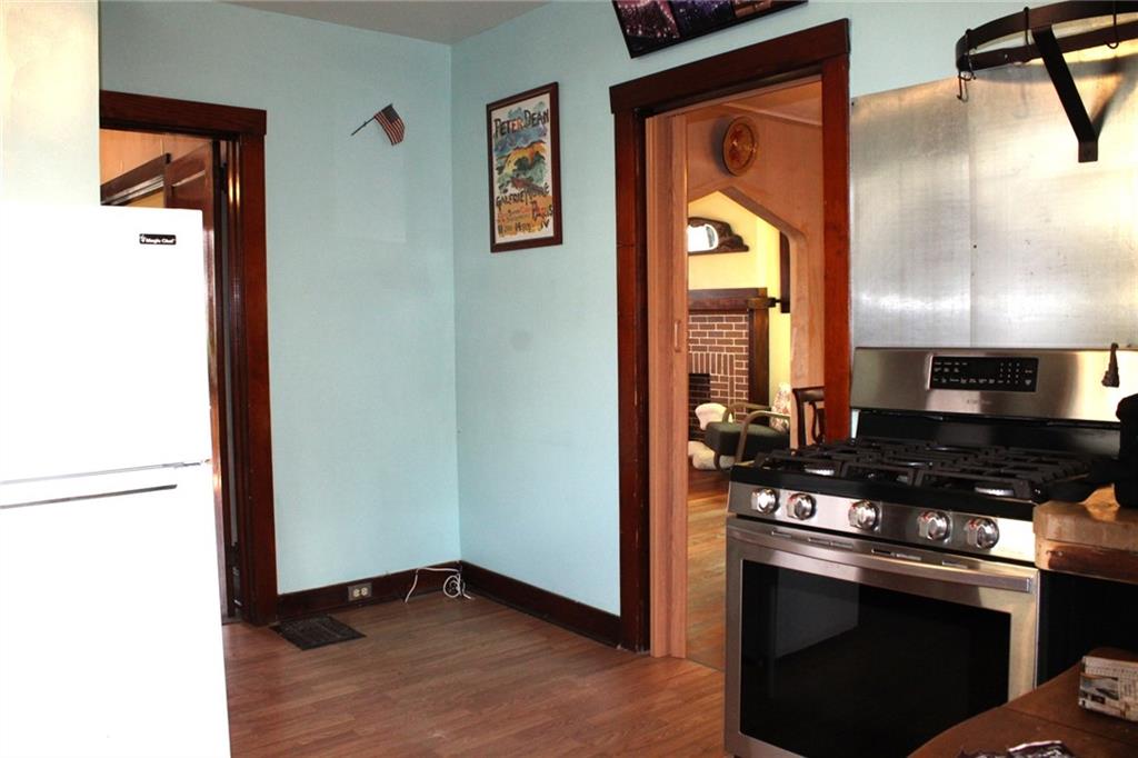 4020 Davis Avenue Homestead, PA 15120 - Photo 18 of 46 a kitchen with a stove and a microwave