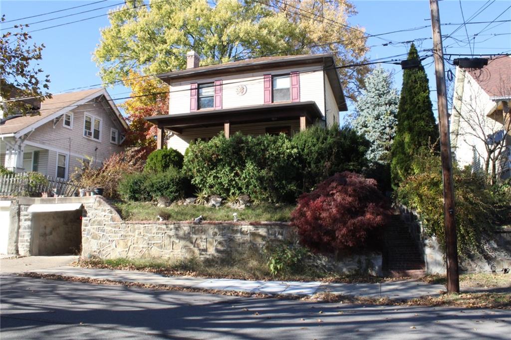 4020 Davis Avenue Homestead, PA 15120 - Photo 2 of 46 a front view of a house with a yard and balcony