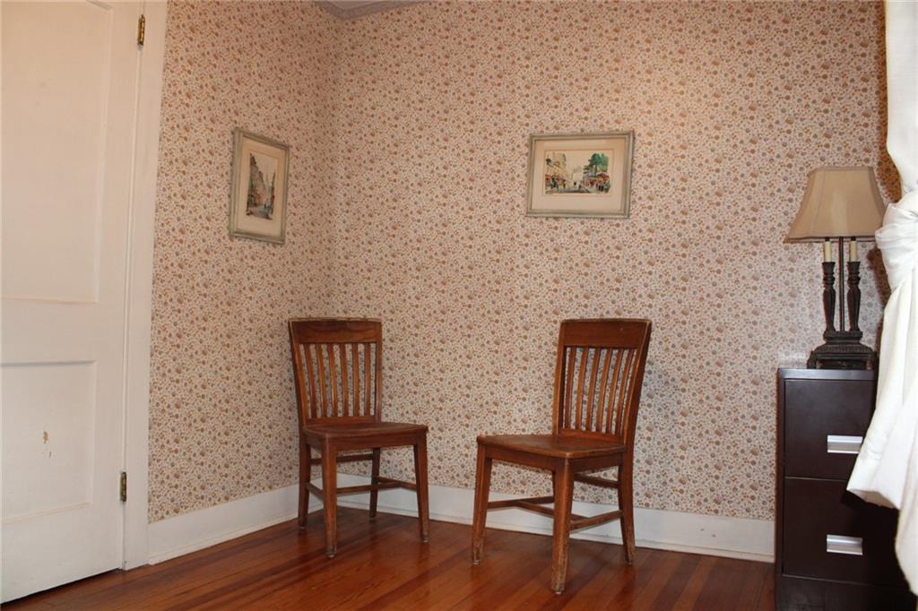 4020 Davis Avenue Homestead, PA 15120 - Photo 22 of 46 a view of a livingroom with furniture and wooden floor
