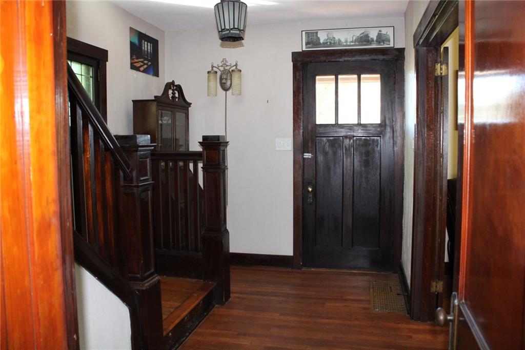 4020 Davis Avenue Homestead, PA 15120 - Photo 3 of 46 a view of a hallway with wooden floor and stairs