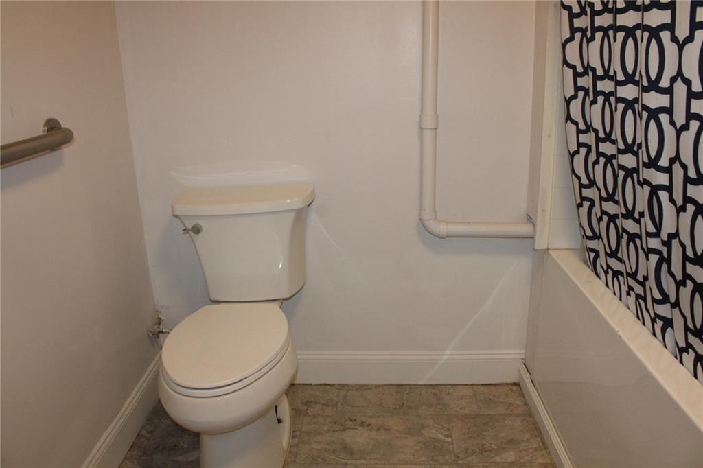 4020 Davis Avenue Homestead, PA 15120 - Photo 38 of 46 a white toilet sitting next to a shower