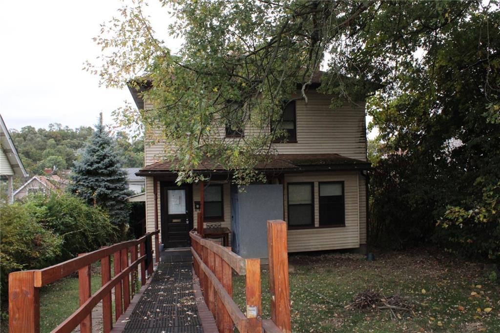 4020 Davis Avenue Homestead, PA 15120 - Photo 40 of 46 a front view of a house with a garden