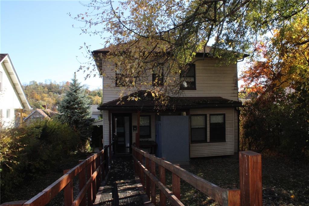 4020 Davis Avenue Homestead, PA 15120 - Photo 41 of 46 a front view of house with yard and green space