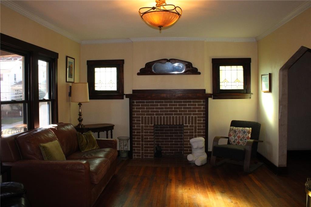 4020 Davis Avenue Homestead, PA 15120 - Photo 6 of 46 a living room with furniture and a wooden floor