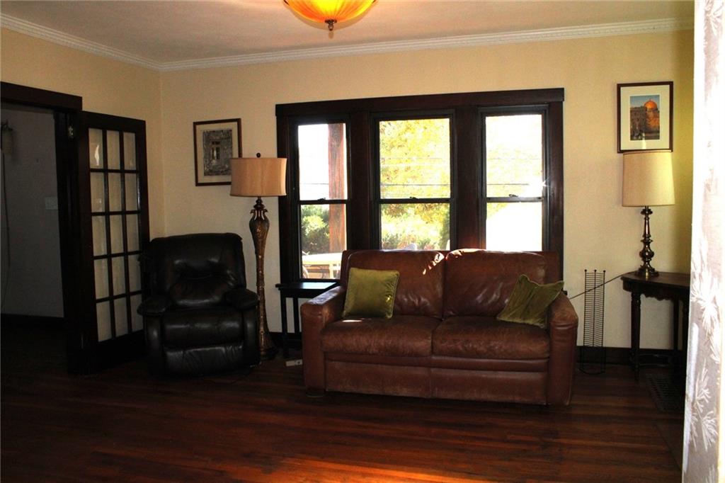 4020 Davis Avenue Homestead, PA 15120 - Photo 7 of 46 a living room with furniture and a floor to ceiling window