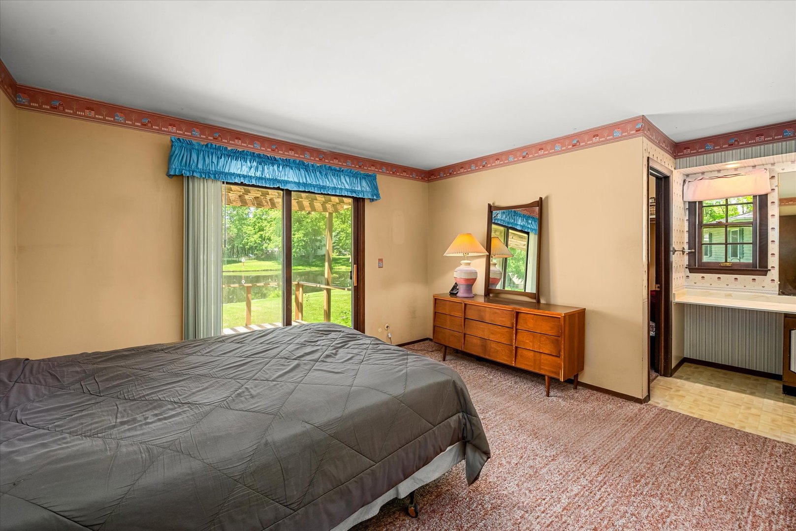 33 Somerset Road Montgomery, IL 60538 - Photo 11 of 17 a bedroom with a bed and a dresser next to a window