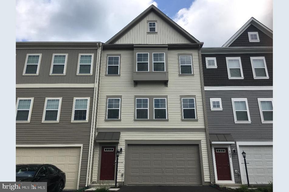 121 Lindy Way Stephenson, VA 22656 - Photo 1 of 23 a front view of a house with many windows