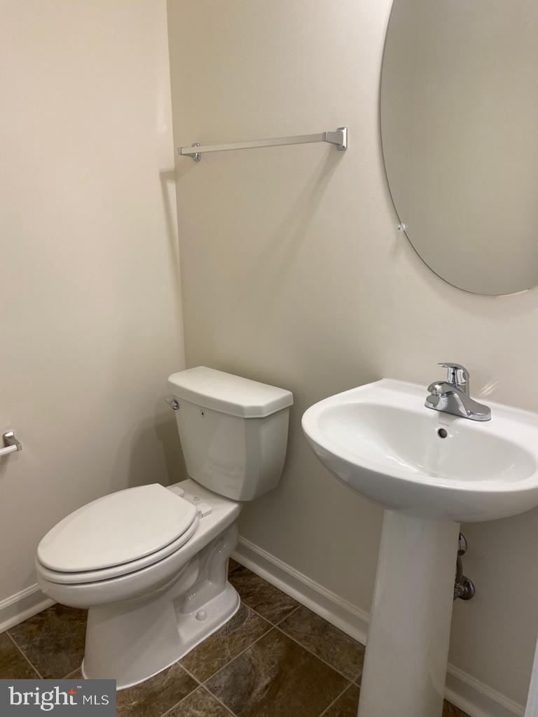 121 Lindy Way Stephenson, VA 22656 - Photo 21 of 23 a white toilet sitting next to a bathroom sink