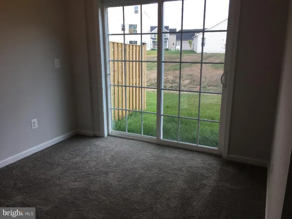 a view of a room with sliding glass door