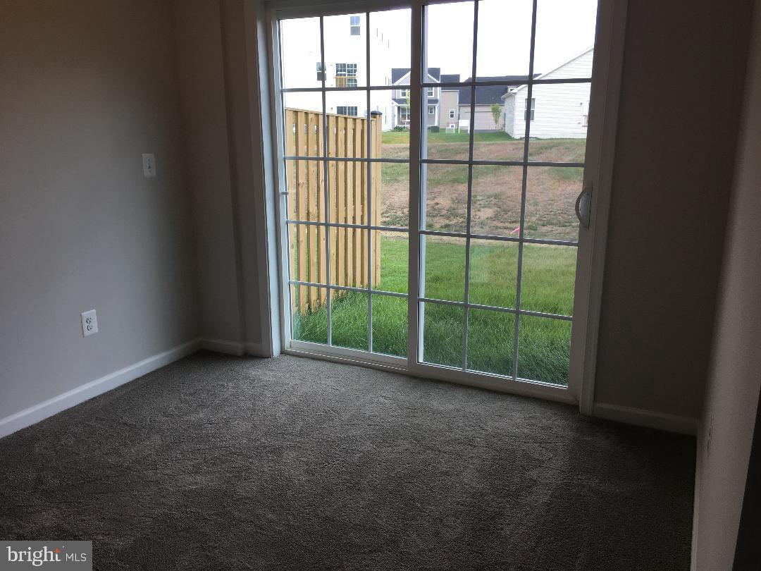 121 Lindy Way Stephenson, VA 22656 - Photo 4 of 23 a view of a room with sliding glass door