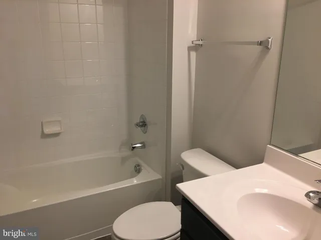 a bathroom with a sink toilet and bathtub