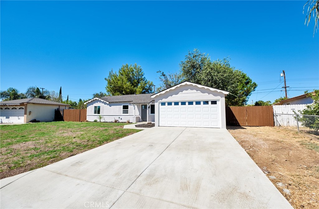 5620 Ellen Street Riverside, CA 92503 - Photo 1 of 1 a front view of a house with a yard