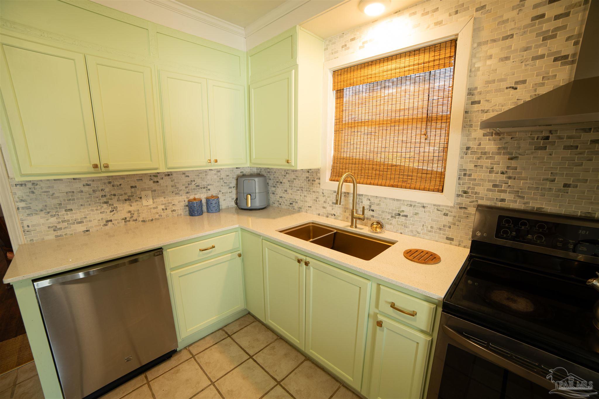 5750 Turkey Road Pensacola, FL 32526 - Photo 11 of 22 a kitchen that has a sink and a stove
