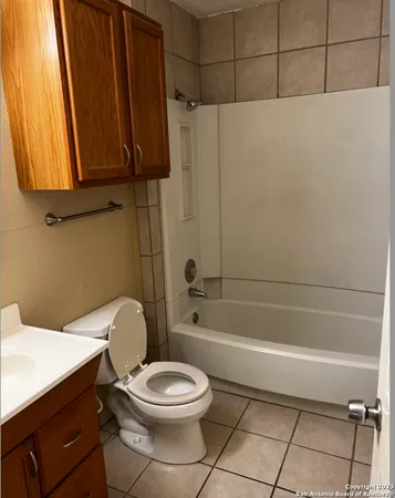 a view of a backyard with a small cabin and a chair