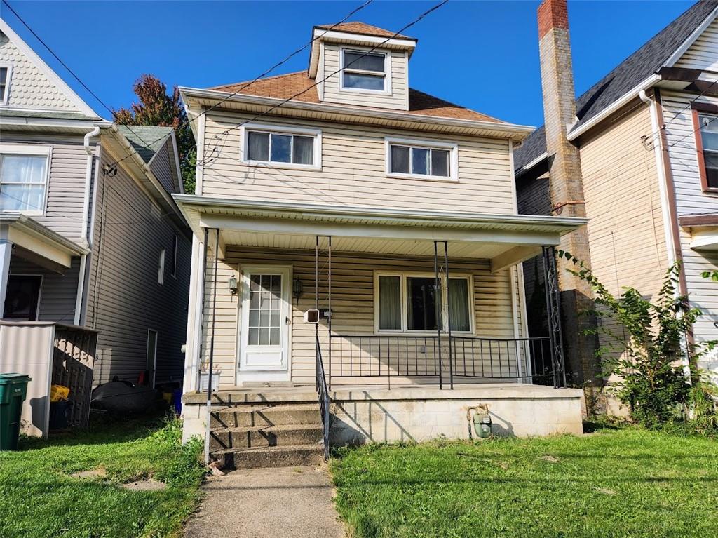 526 New Castle Street Butler, PA 16001 - Photo 1 of 29 a front view of a house with garden