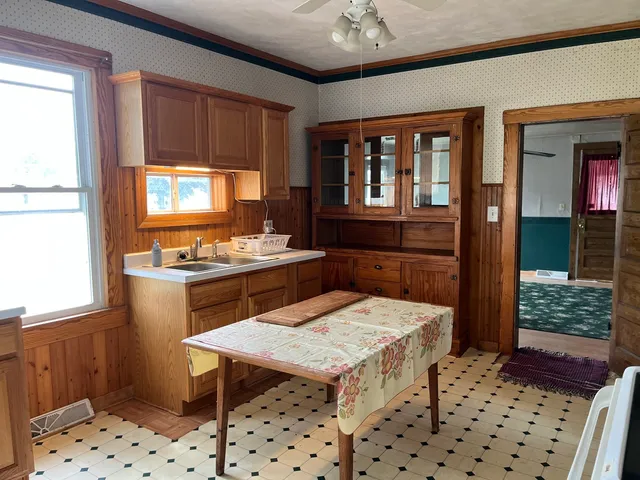 a kitchen with stainless steel appliances a sink stove and refrigerator