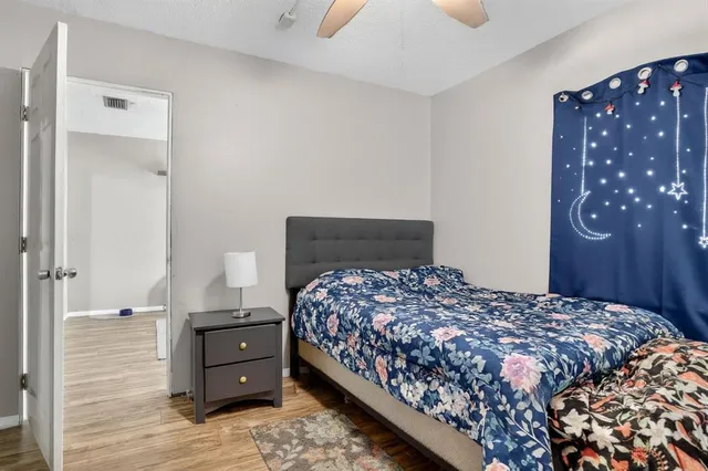 a bedroom with a bed and a dresser