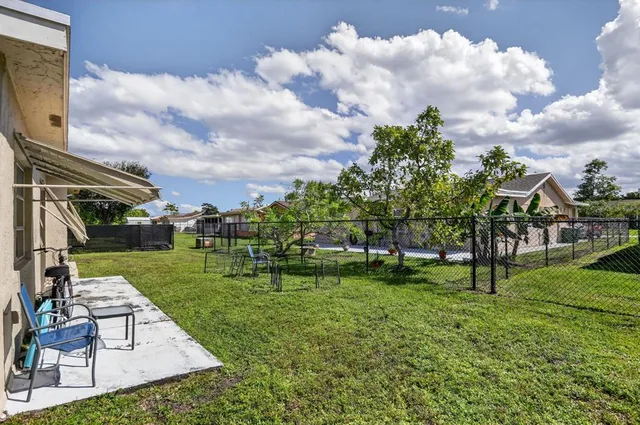 a view of a park with large trees