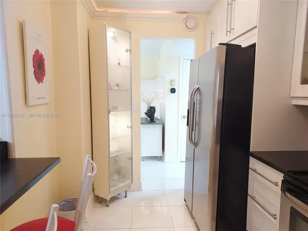 a bathroom with a shower and a sink