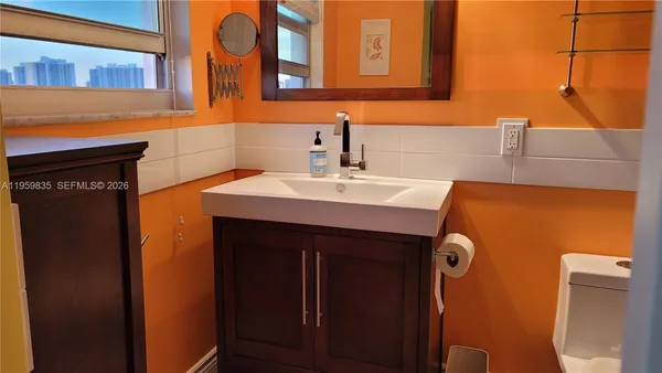 a sink sitting next to a bathroom sink