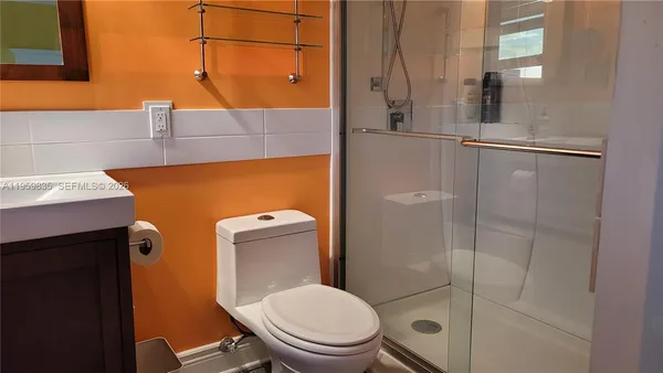 a bathroom with a toilet and a sink