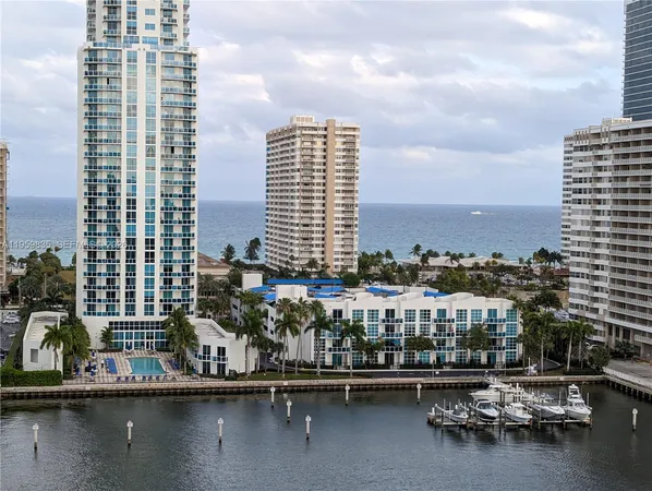 a view of a lake with tall buildings