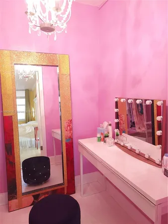 a bathroom with a sink vanity and mirror