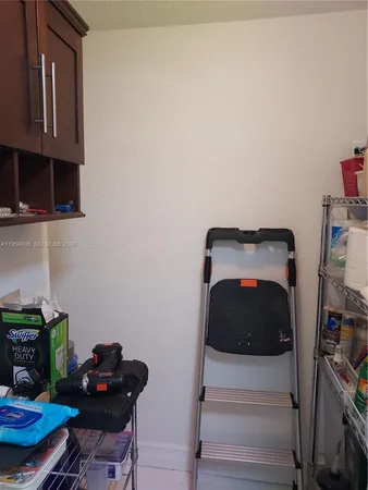 a bedroom with a bed and a chair