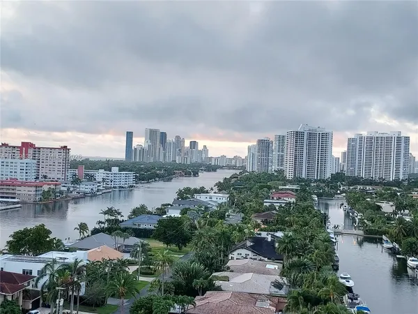 a view of a lake with tall buildings