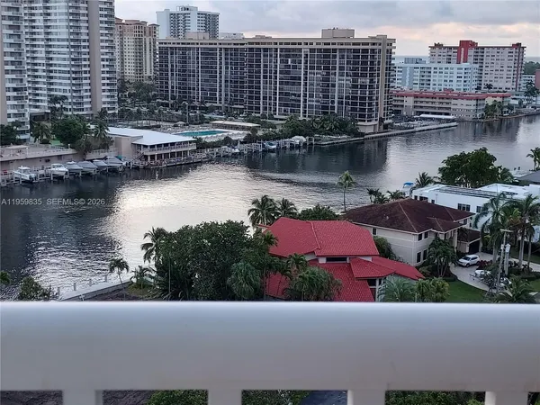a view of a lake with tall buildings