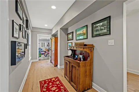 a dining room with furniture and a window