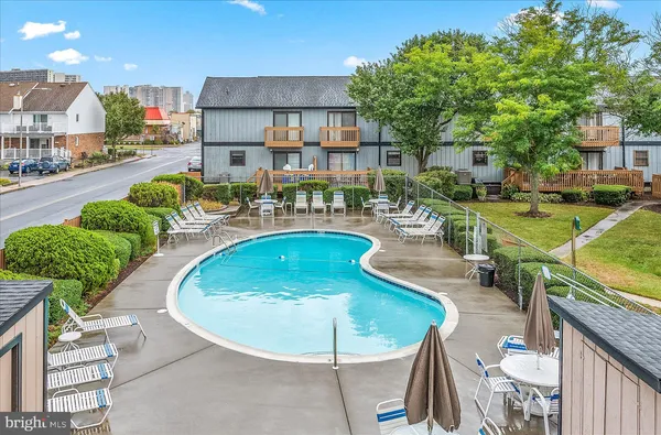 a view of a swimming pool with a patio