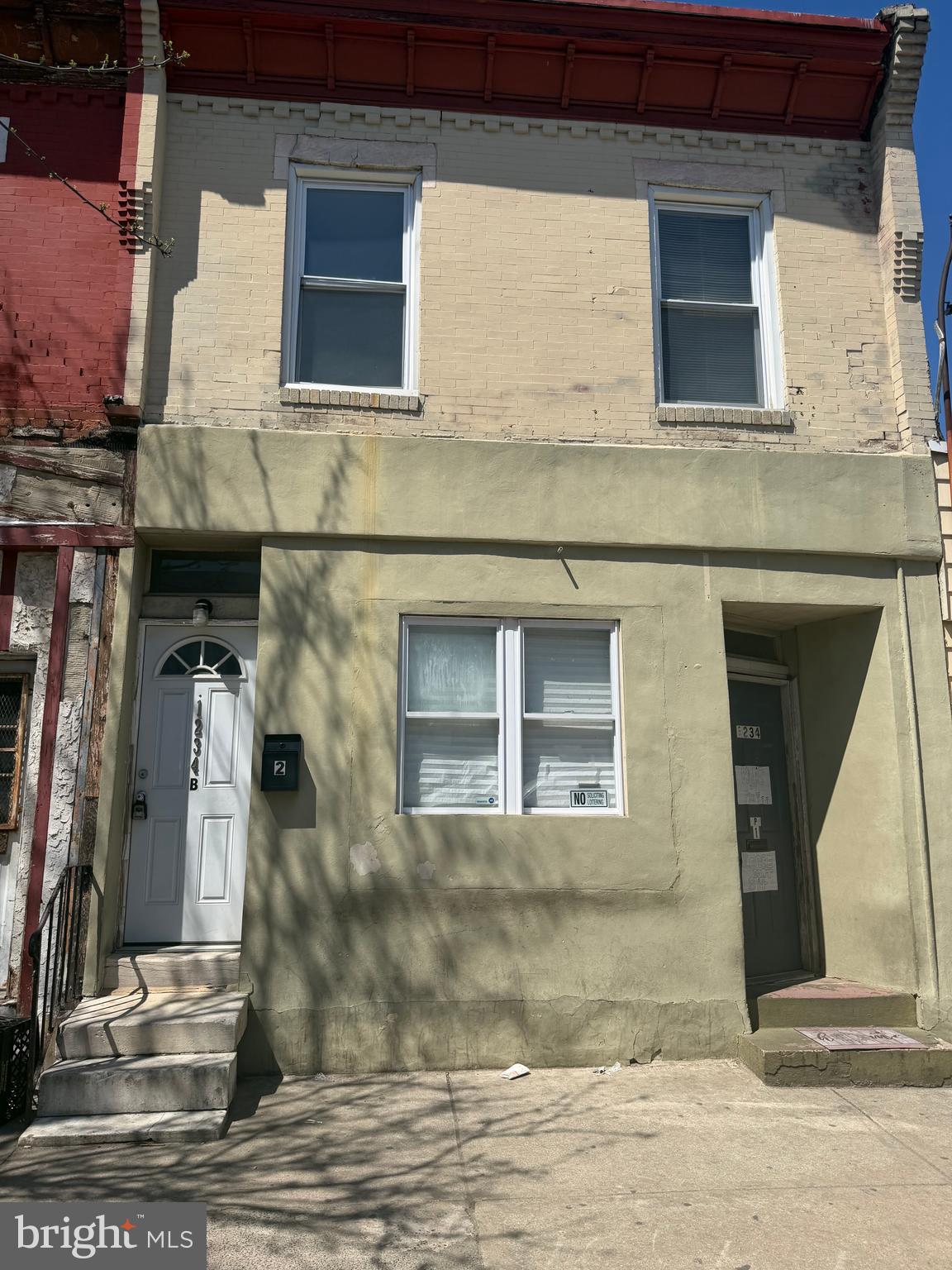 1234 Point Breeze Avenue Philadelphia, PA 19146 - Photo 1 of 15 a front view of a house with a yard